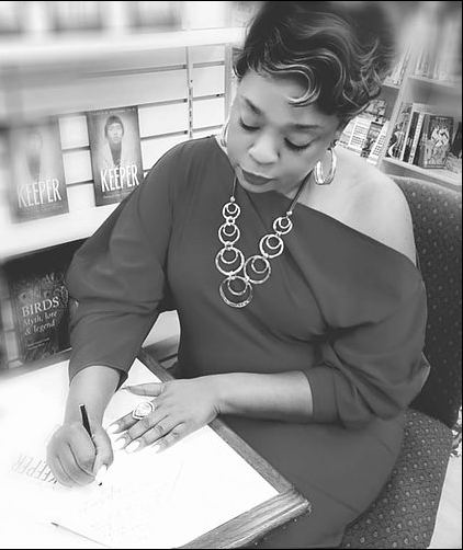 Dr. Sheila D. Williams signing her book